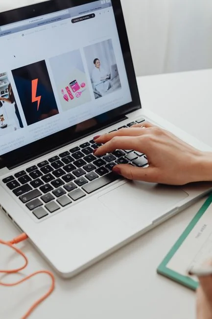 A contemporary workspace showcasing a laptop, tablet, and smartphones, ideal for tech and freelance use.